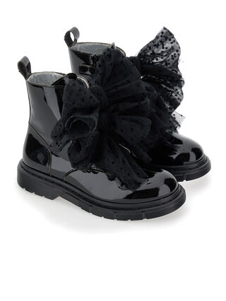 Leather combat boots with tulle bows