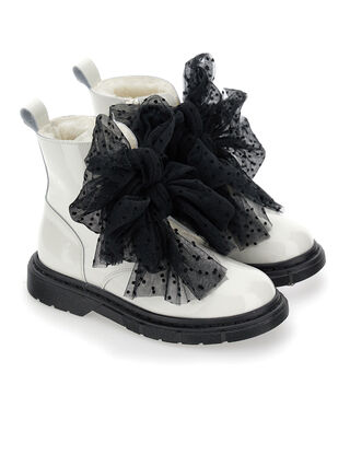 Sheepskin and leather combat boots with bows