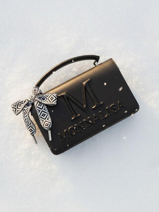 Iconic bag decorated with bow